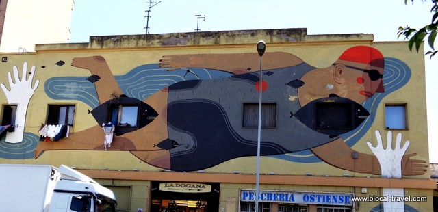 street art by Agostino Iacurci on via del porto fluviale, ostiense, rome