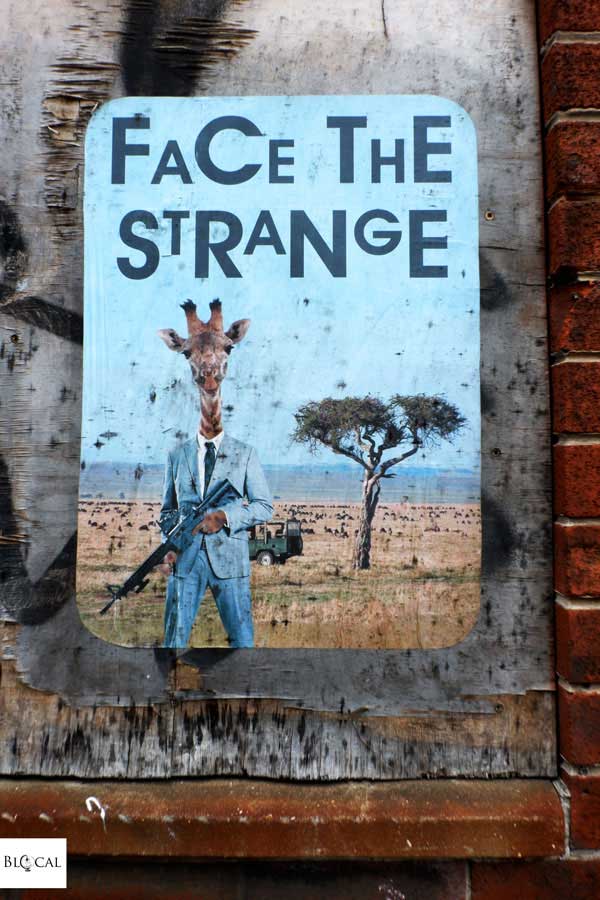 Face the strange poster street art Liverpool