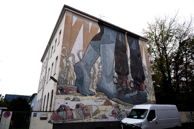 Street art in Munich mural by Aryz
