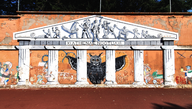 UndiciSei Squad mural in Nuoro Italy street art Sardinia.